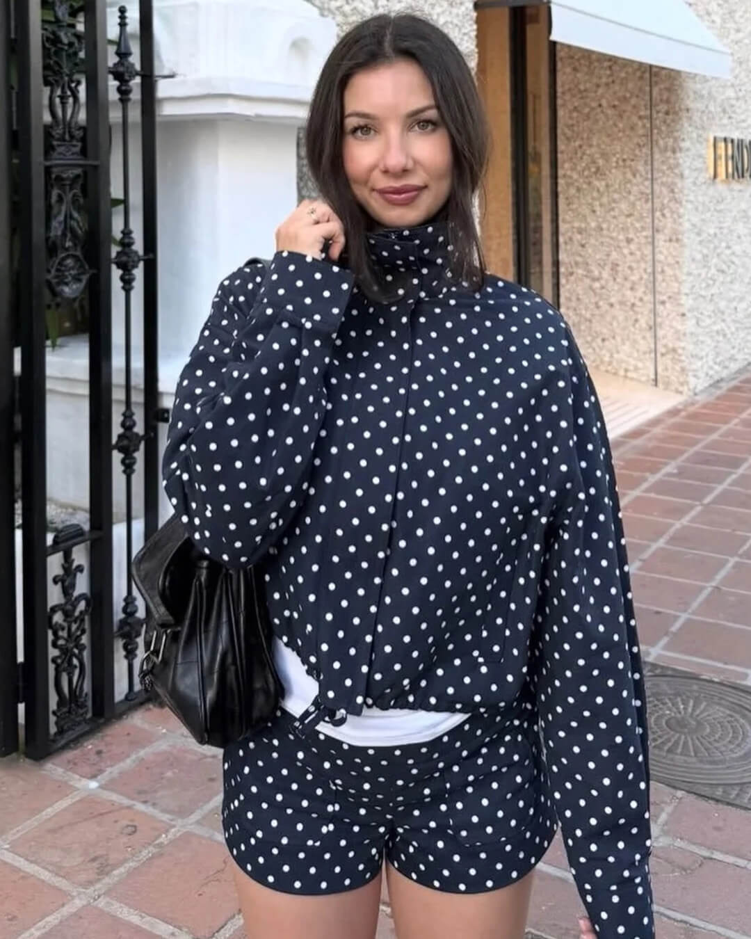 Women's polka dot cropped jacket with high collar and long sleeves