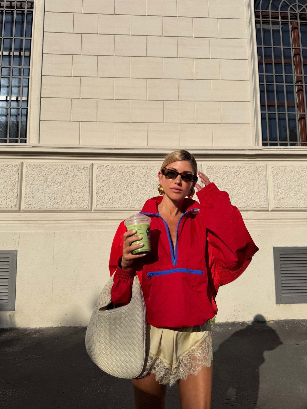 Women's cropped half-zip windbreaker jacket with stand collar and zipped chest pocket