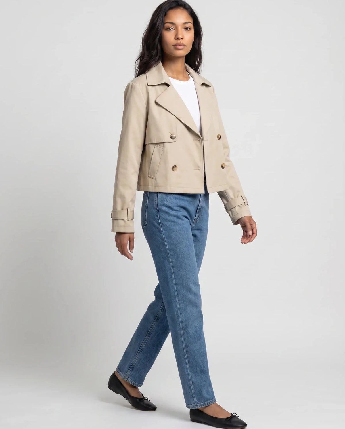Women's beige cropped double-breasted trench jacket with long sleeves and cuff straps