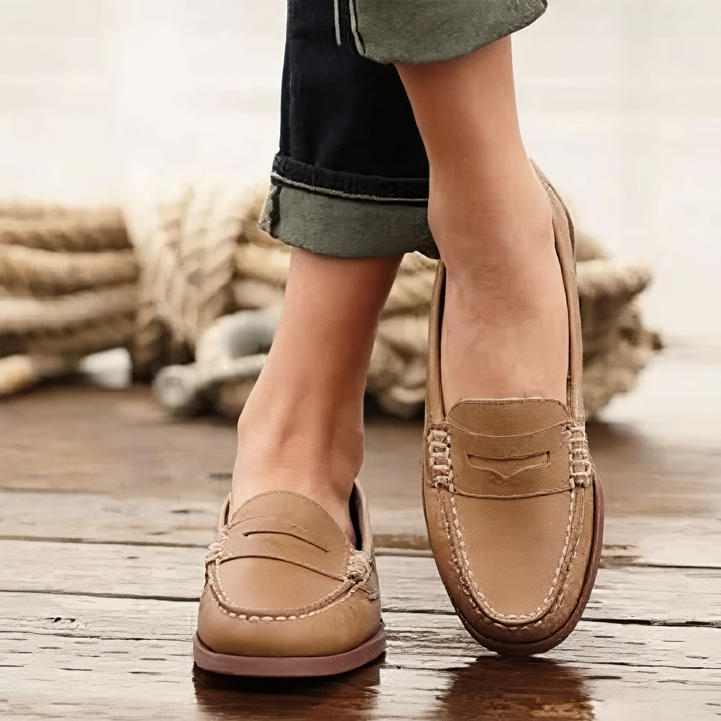 Women's penny loafers with moc-toe stitching and low heels