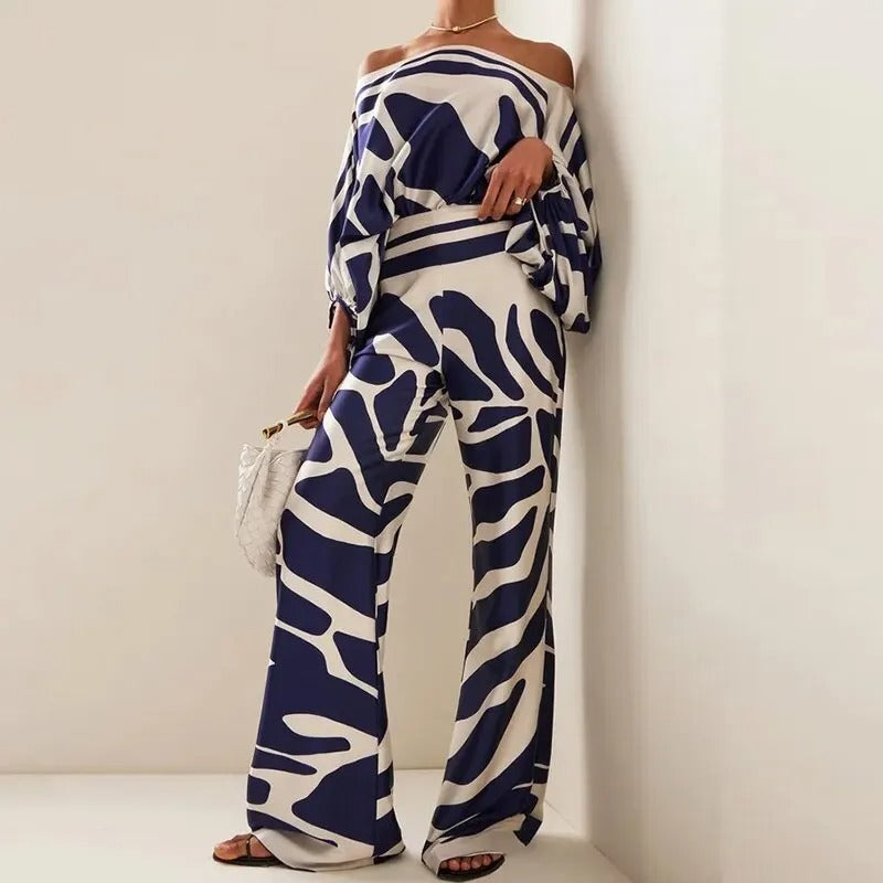Women's off-shoulder batwing top and wide-leg trousers co-ord set with bold striped patterns