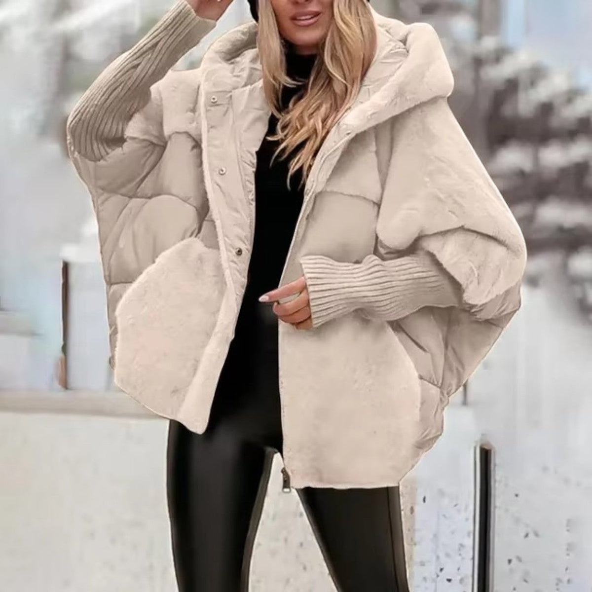 Women's oversized padded hooded jacket with ribbed cuffs and zip front