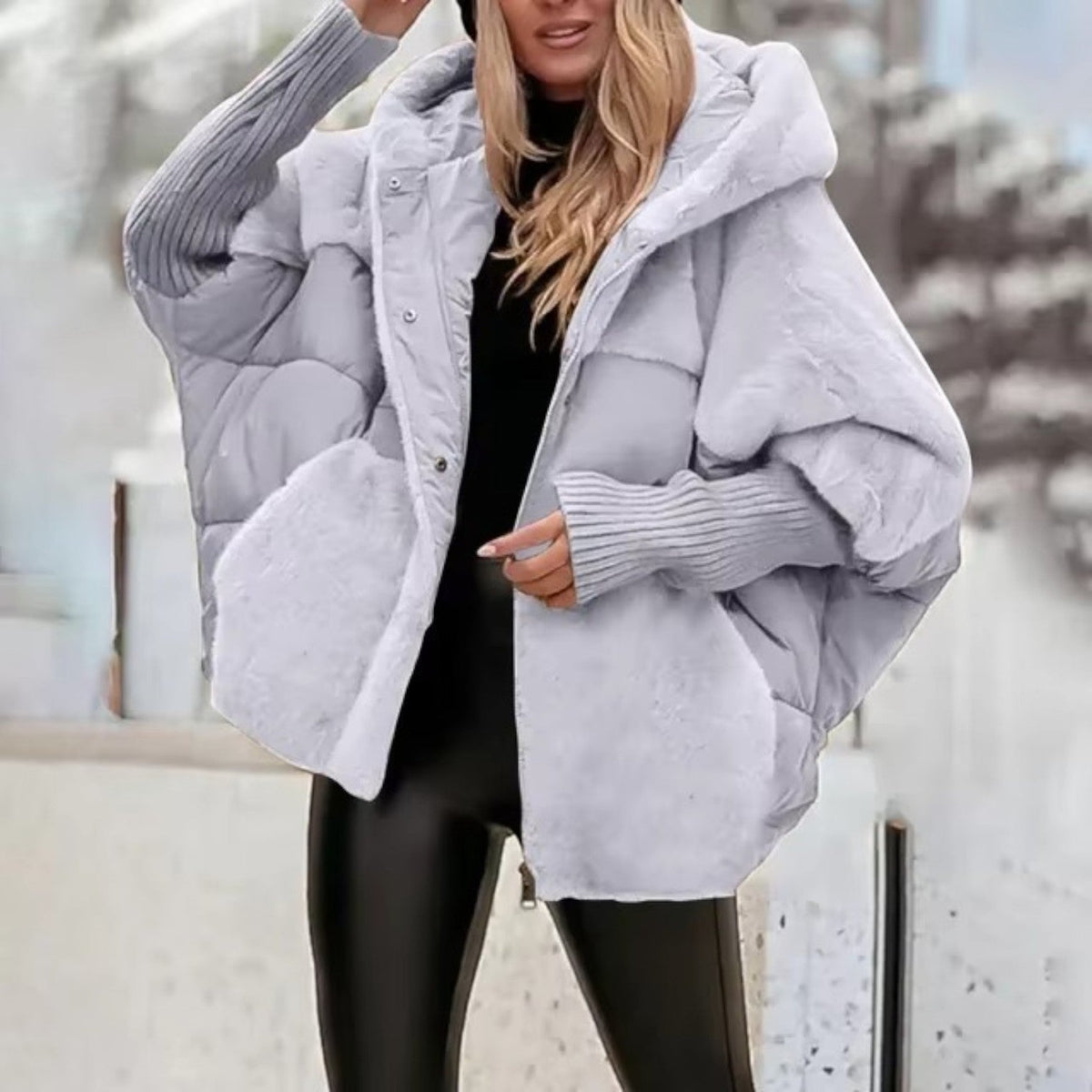 Women's oversized padded hooded jacket with ribbed cuffs and zip front