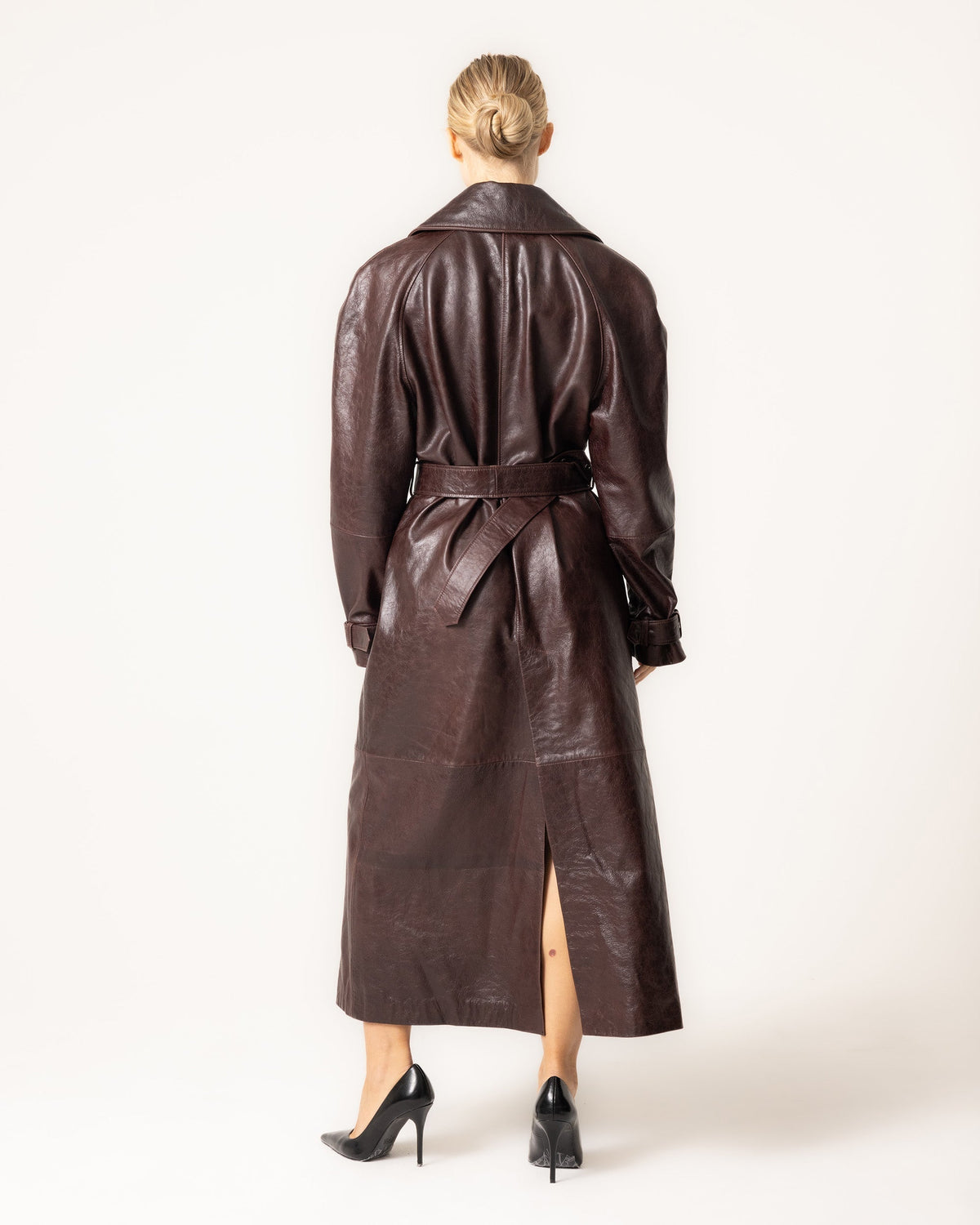 Women's brown belted trench coat with wide collar and long sleeves