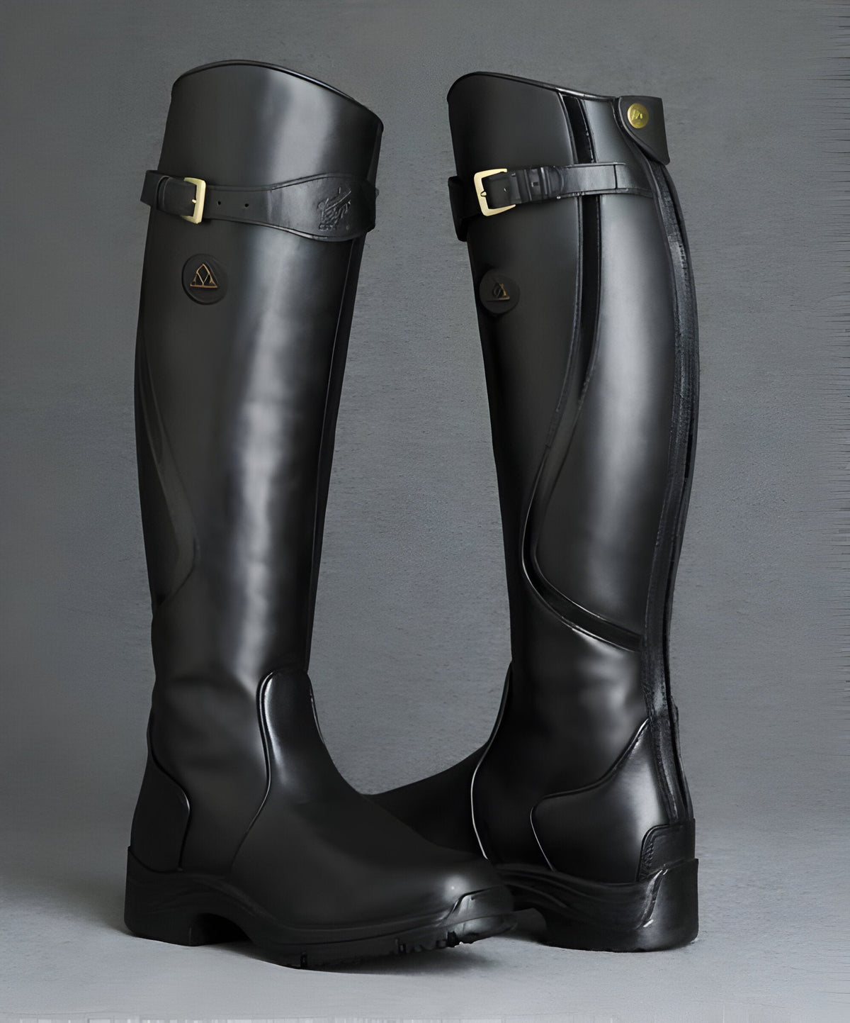 Women's tall riding boots with buckle straps, side zips and low heels