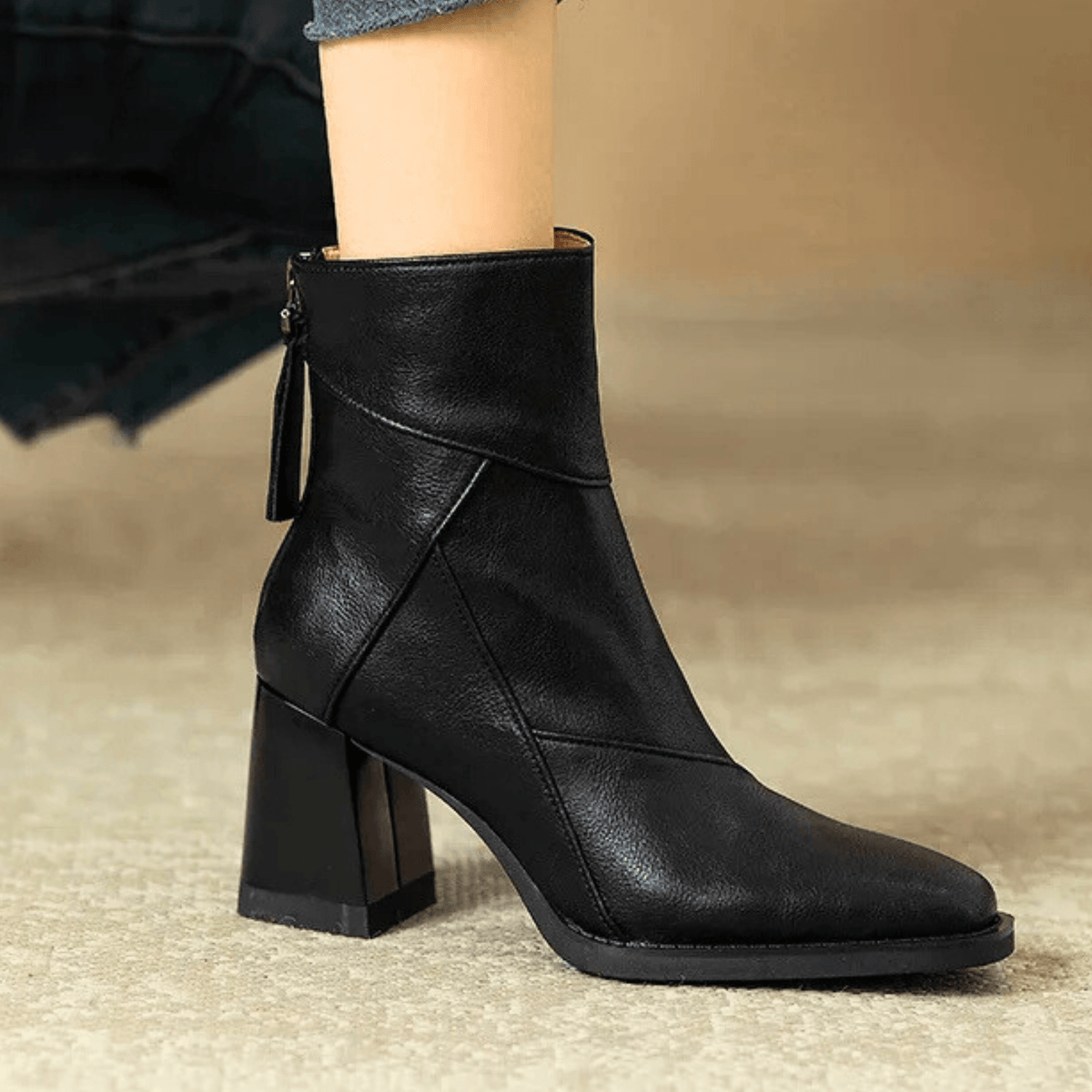 Women's pointed toe ankle boots with high flared block heels and stitched panel details