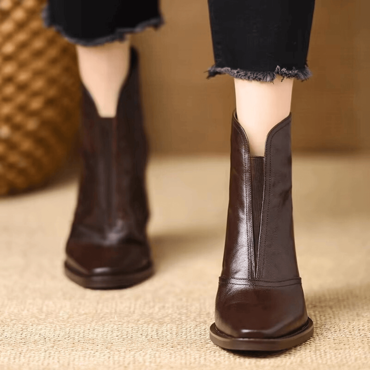 Women's pointed-toe heeled ankle boot with a mid block heel