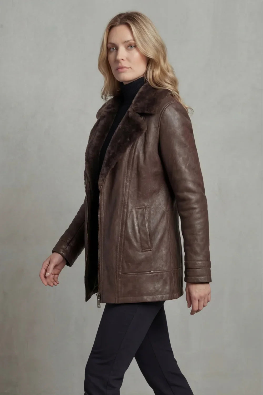 Women's brown jacket with a wide fur-trimmed collar and front zip fastening