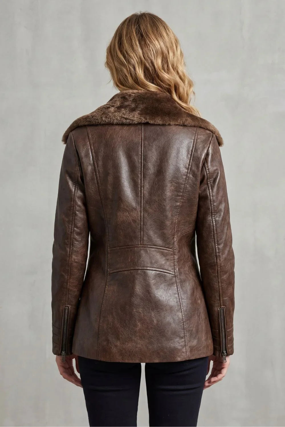 Women's brown jacket with a wide fur-trimmed collar and front zip fastening