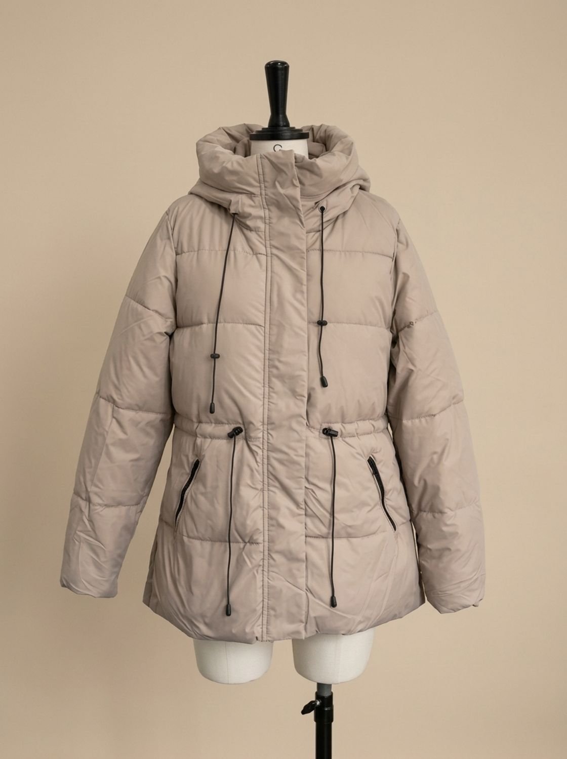 Women's hooded quilted puffer jacket with long sleeves and textured hood trim