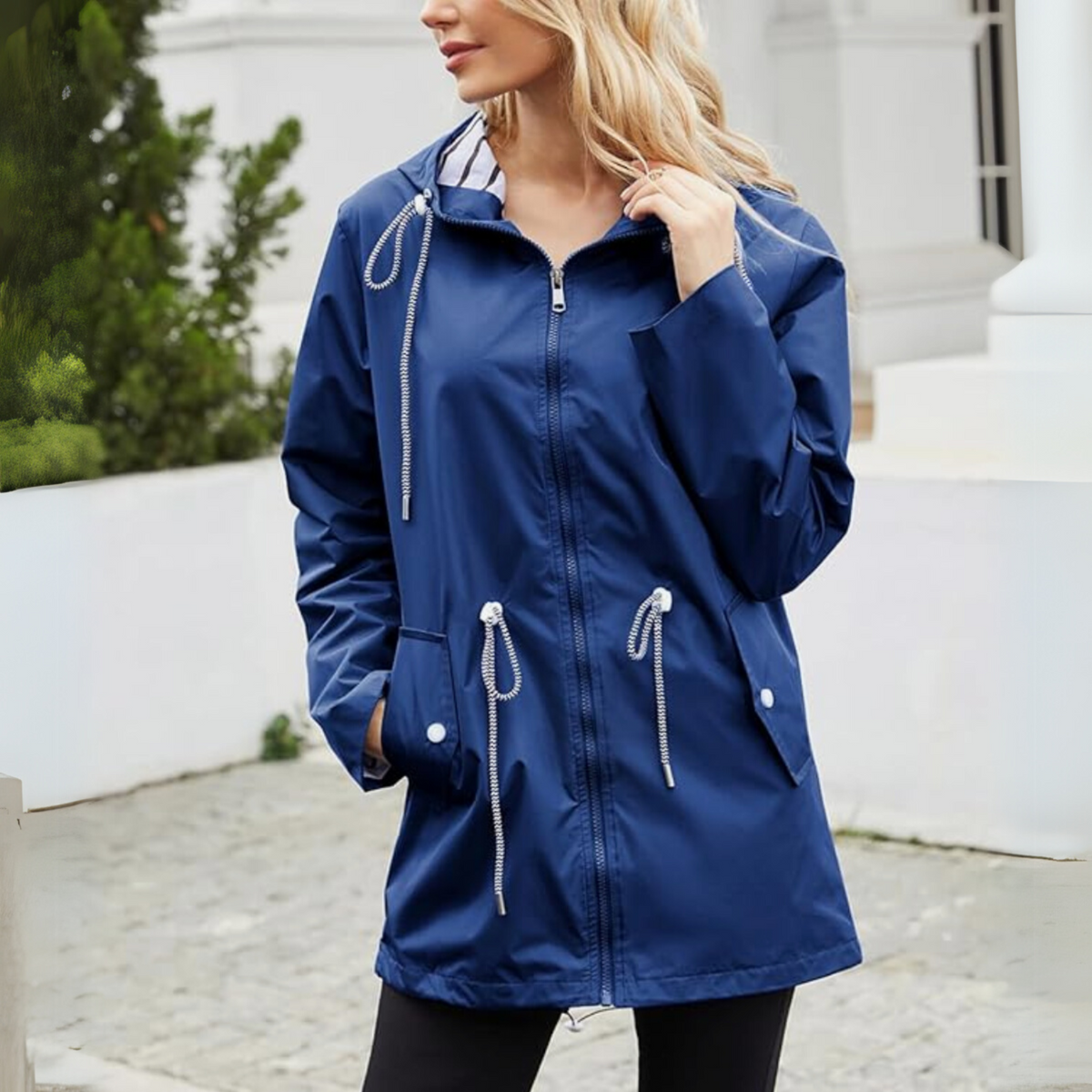 Women's hooded longline jacket with striped lining, zipped pockets and full front zip