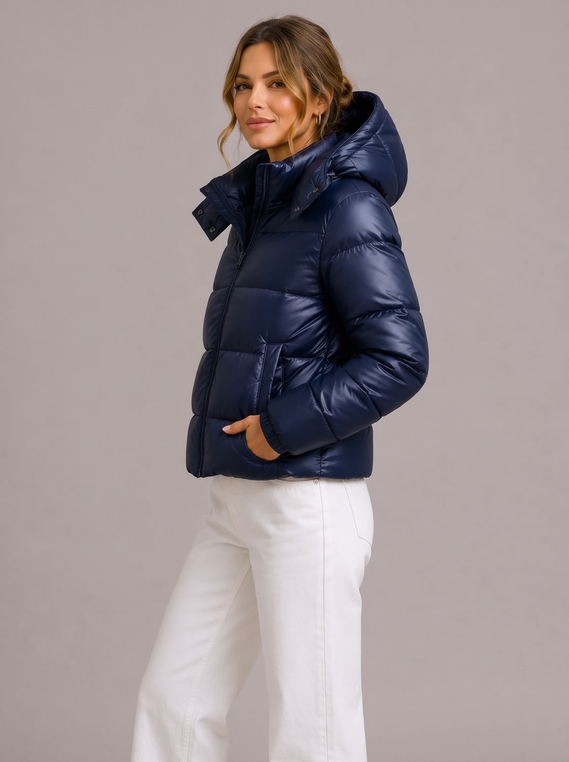 Women's hooded quilted puffer jacket with long sleeves and zip front