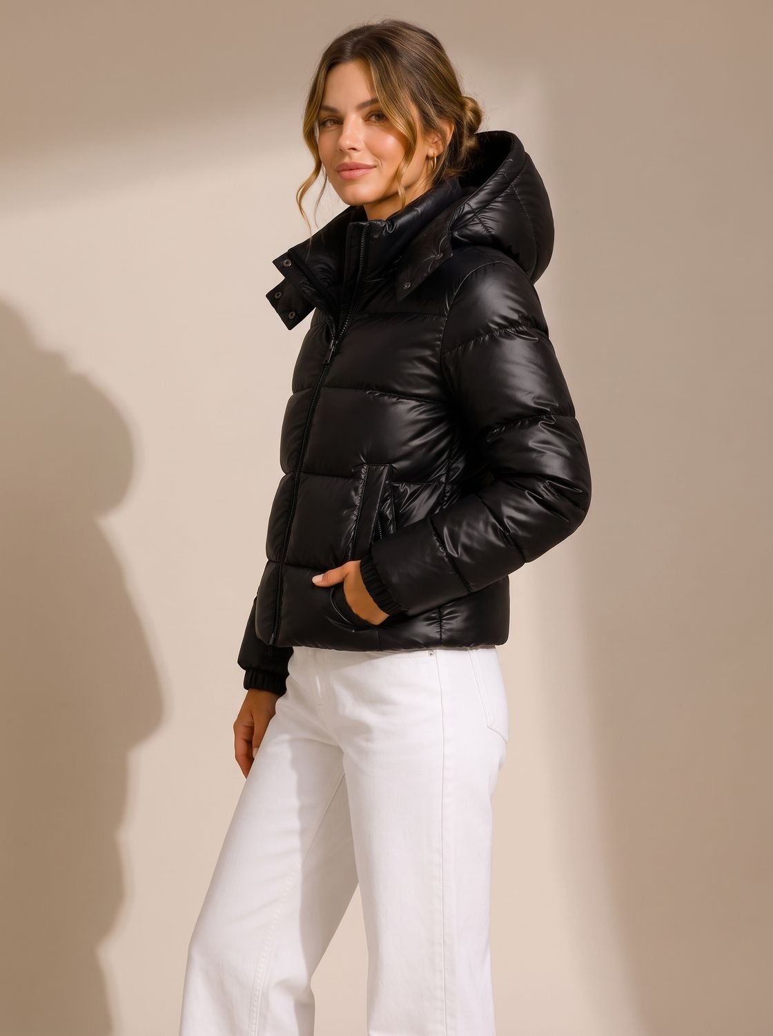 Women's hooded quilted puffer jacket with long sleeves and zip front