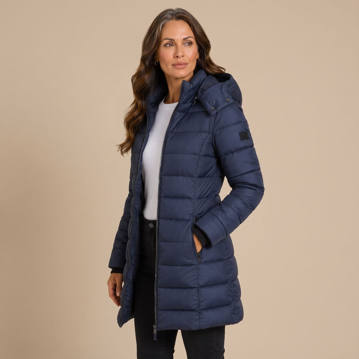Women's hooded quilted puffer jacket with long sleeves and zip front