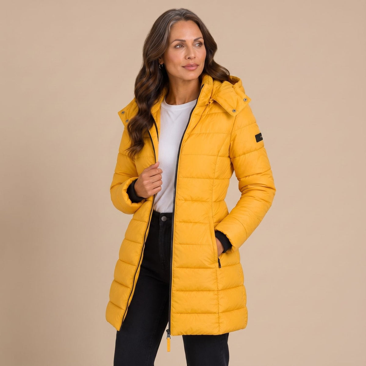 Women's hooded quilted puffer jacket with long sleeves and zip front