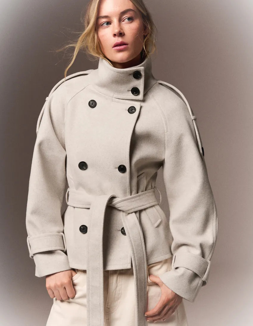 Women's belted double-breasted trench coat with long sleeves and high collar