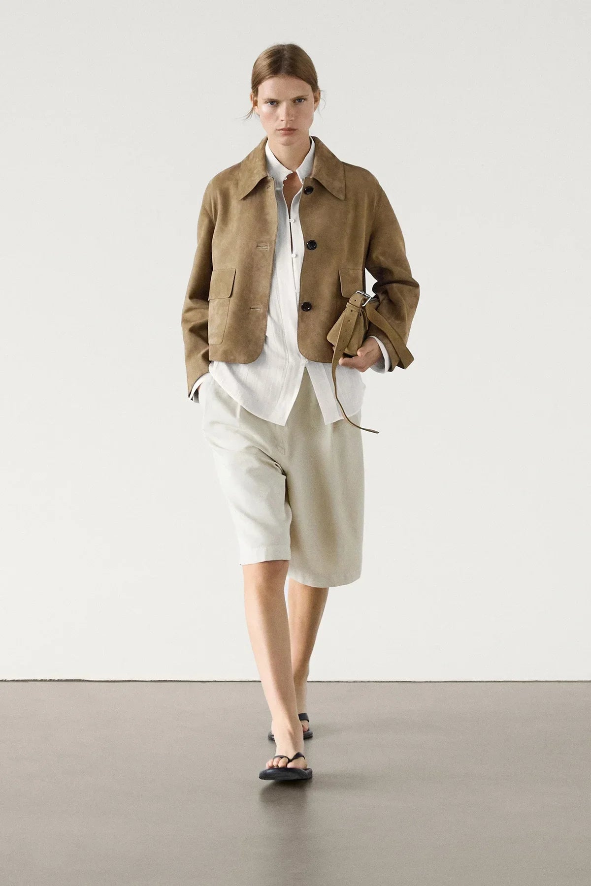 Women's sand cropped jacket with pointed collar, button front and flap pockets
