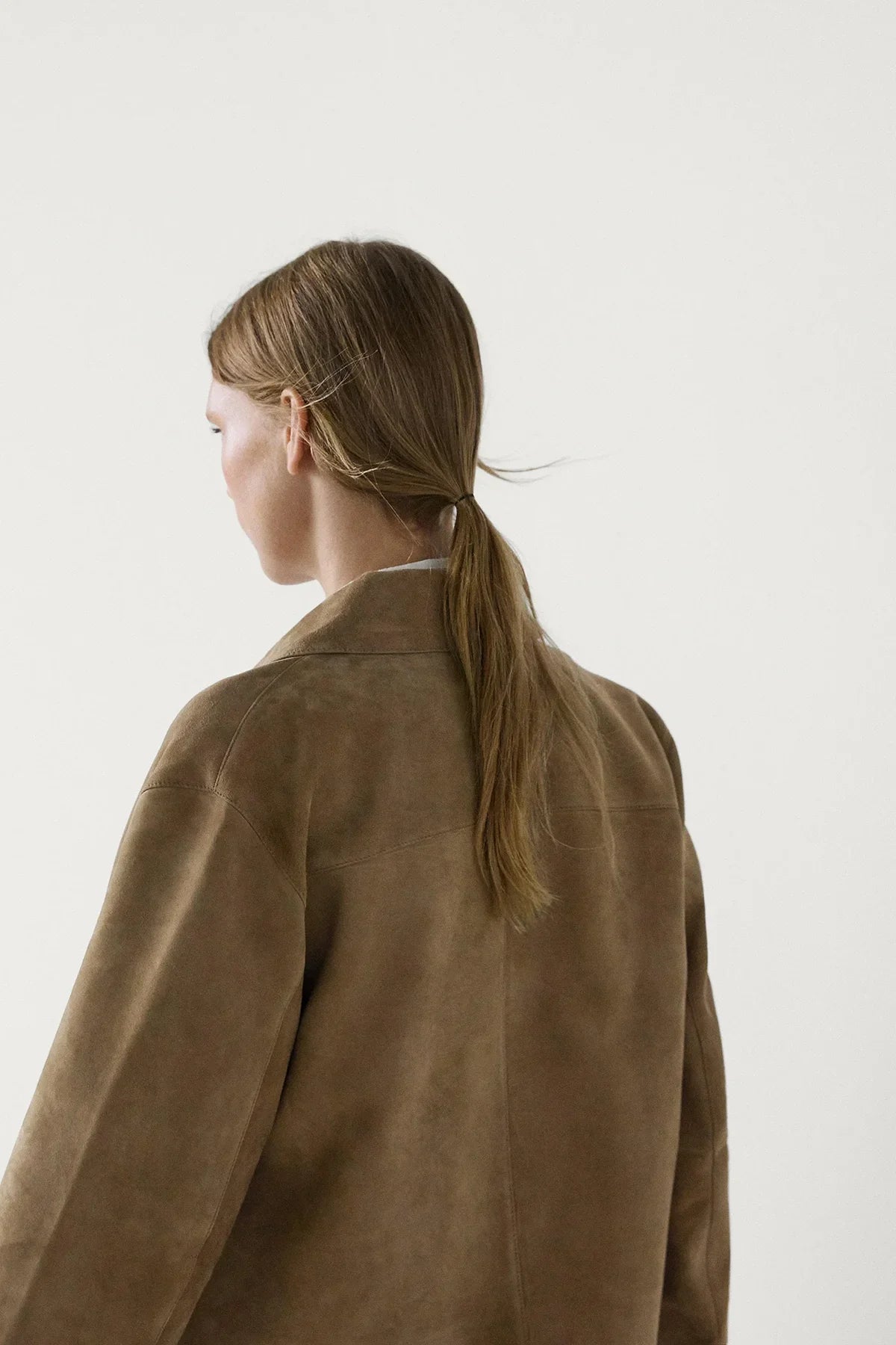 Women's sand cropped jacket with pointed collar, button front and flap pockets