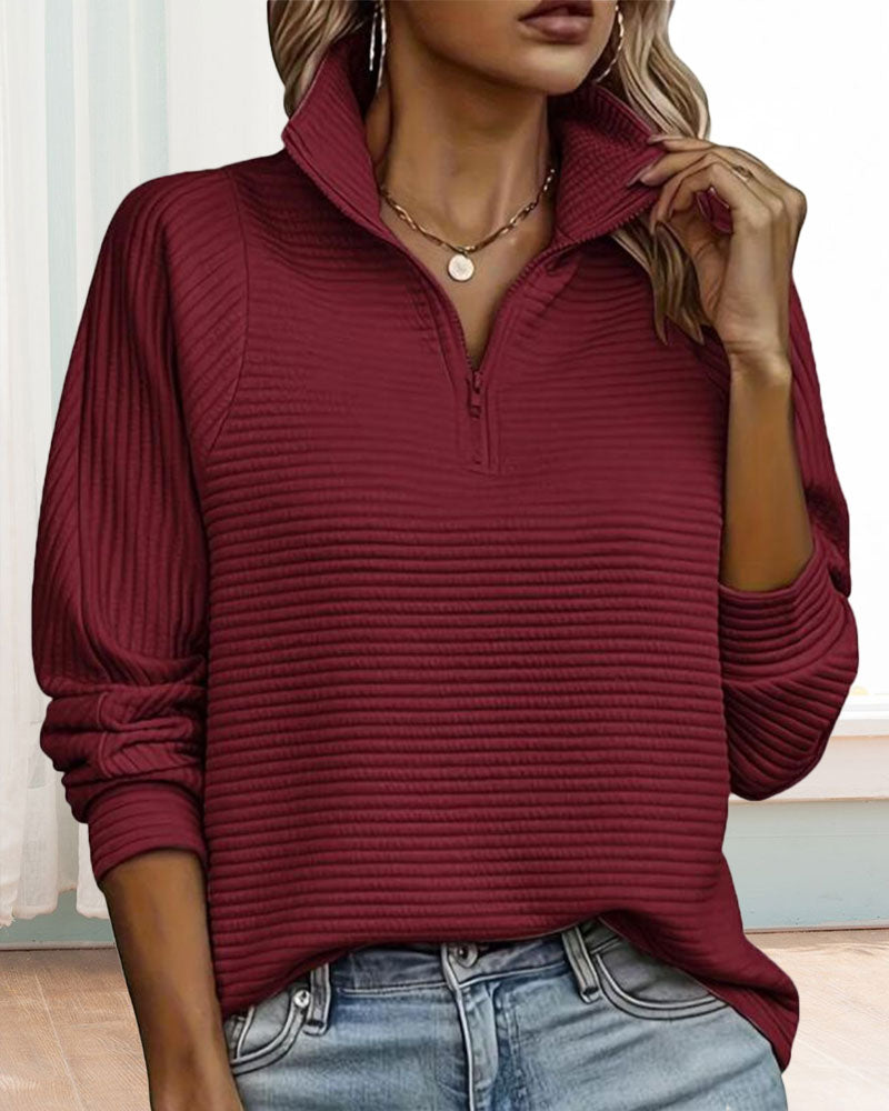 Women's ribbed quarter-zip sweatshirt with a high stand collar and long sleeves