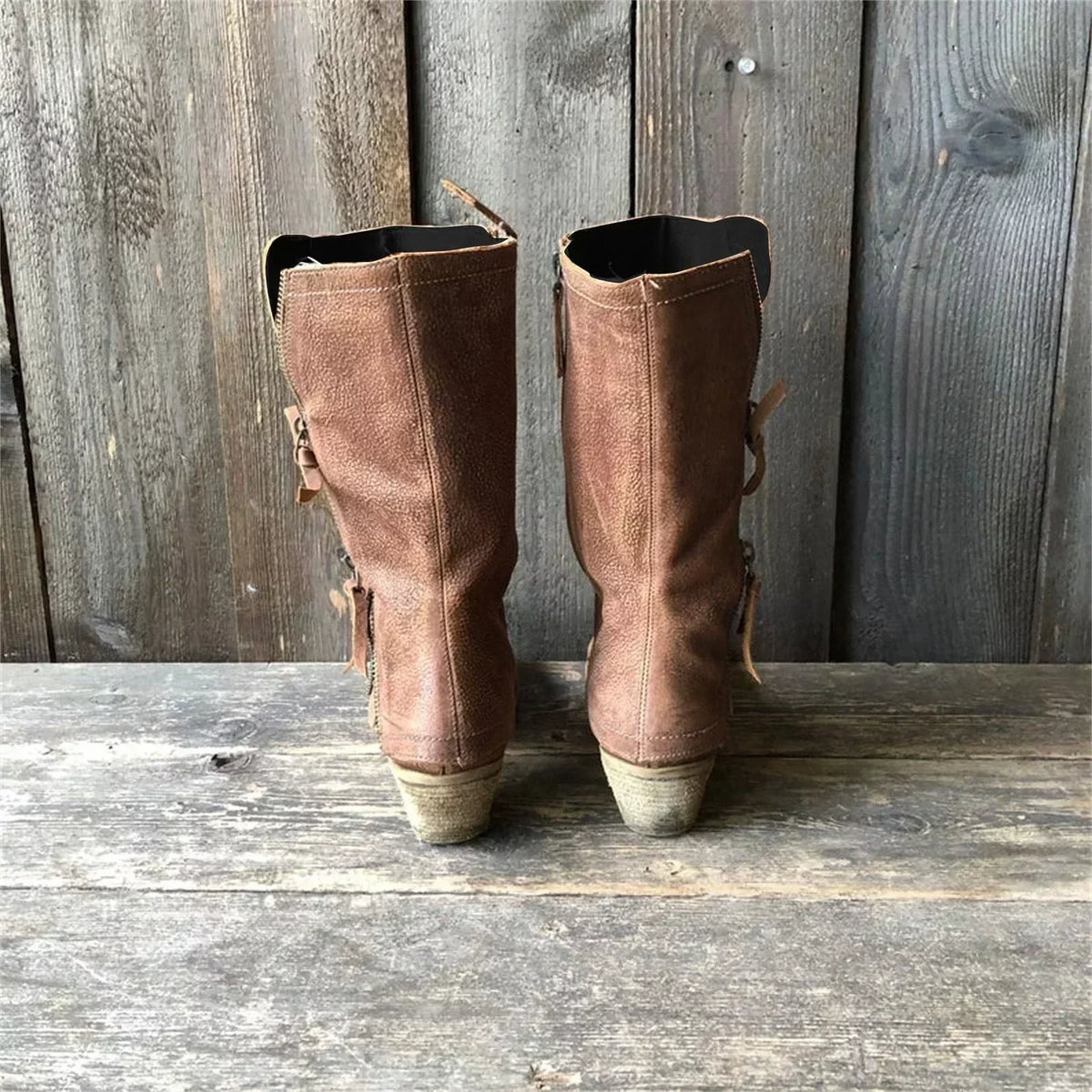 Women's brown tall boots with side zips, stitched panels and low heels