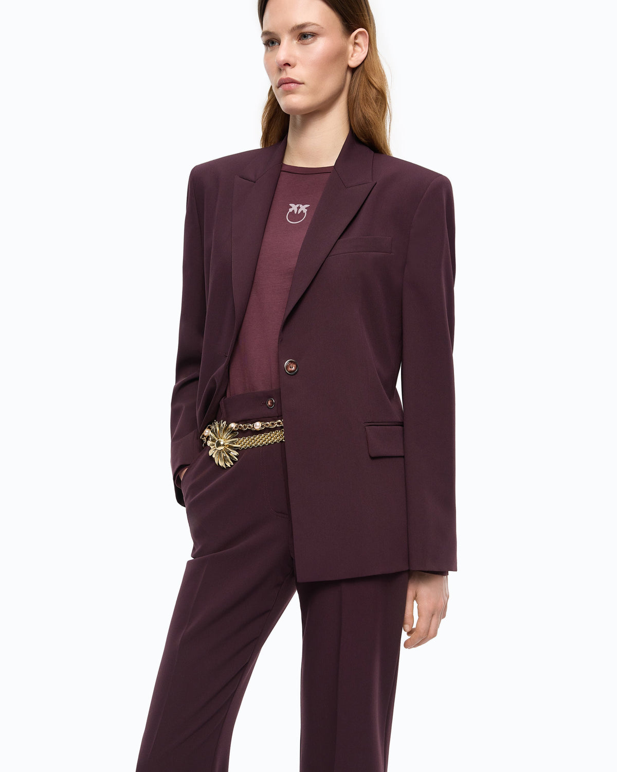 Women's burgundy tailored blazer with notched lapels and flap pockets