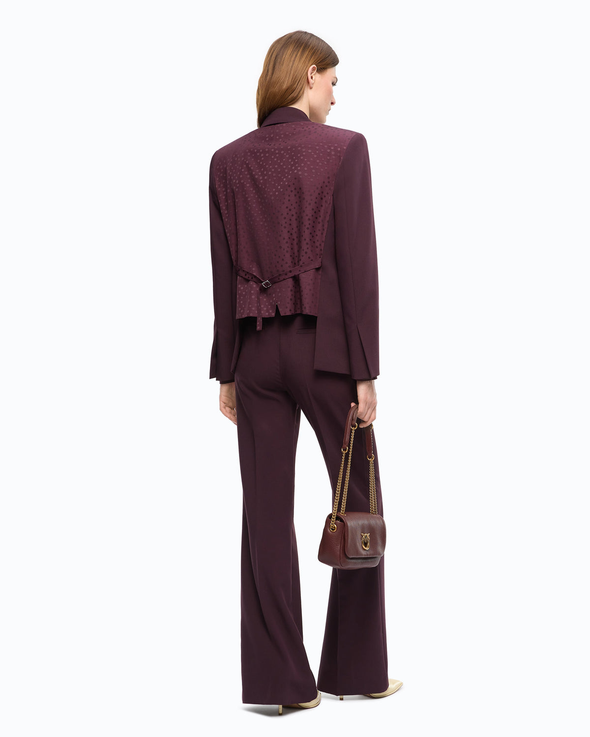 Women's burgundy tailored blazer with notched lapels and flap pockets