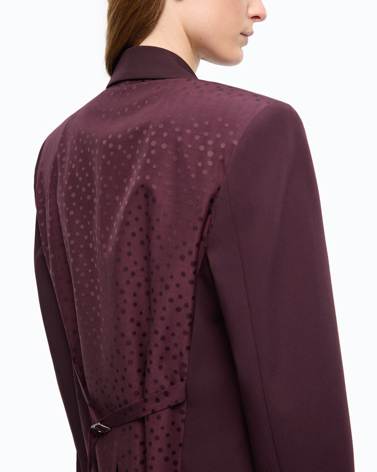 Women's burgundy tailored blazer with notched lapels and flap pockets