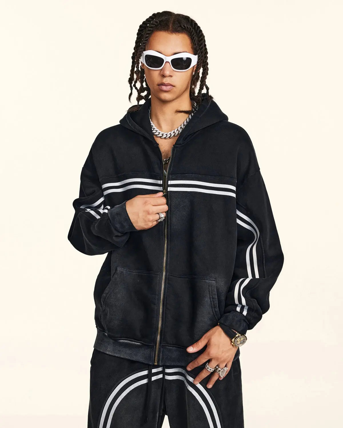Black hooded zip-up hoodie with white double stripes and front pockets