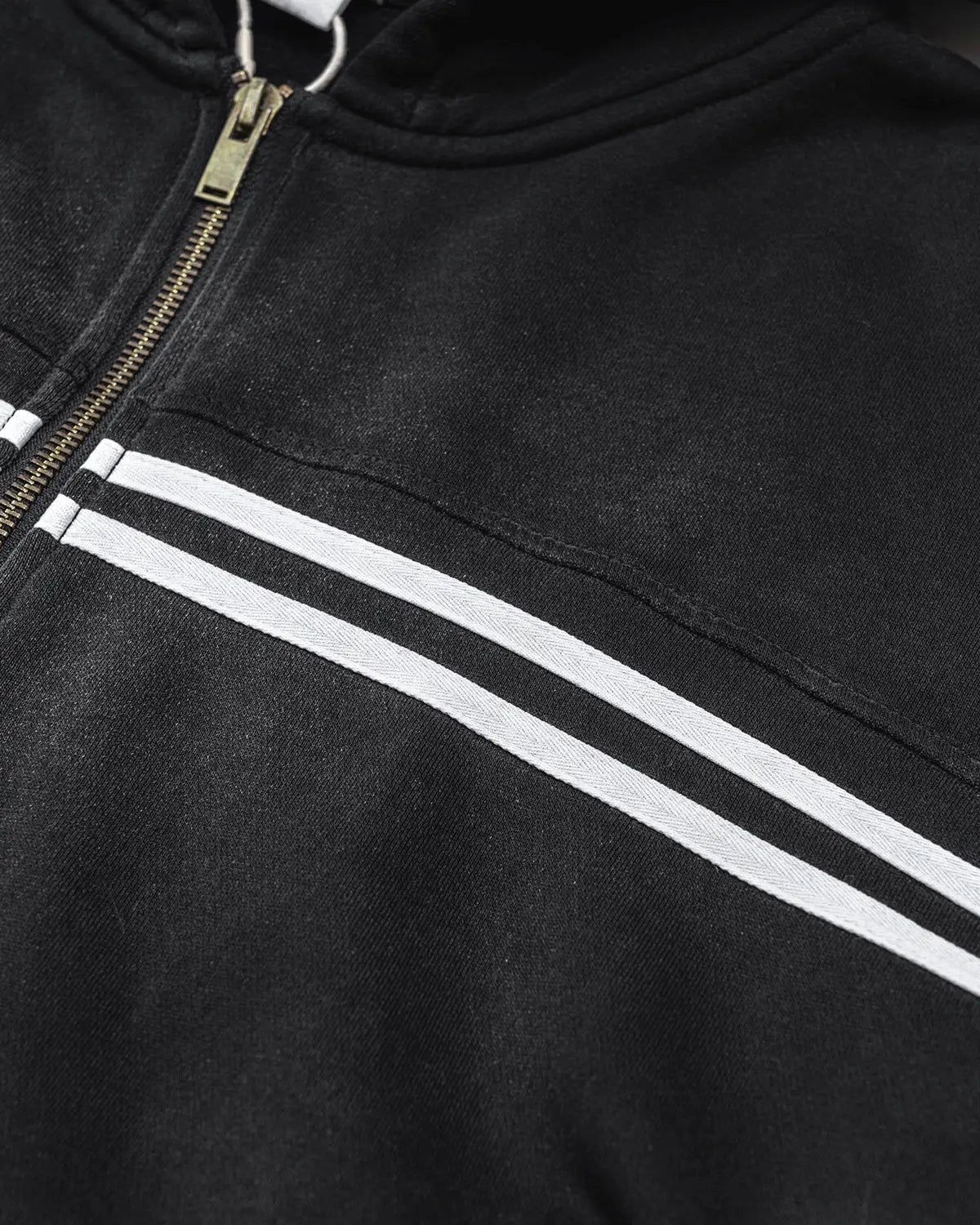 Black hooded zip-up hoodie with white double stripes and front pockets