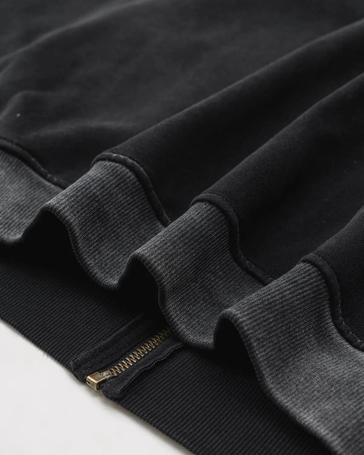 Black hooded zip-up hoodie with white double stripes and front pockets