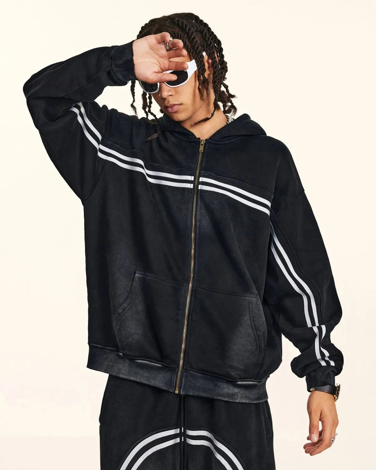 Black hooded zip-up hoodie with white double stripes and front pockets