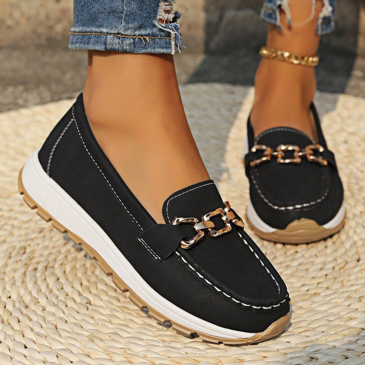 Women's flat loafers with metallic buckle trim and textured lug soles