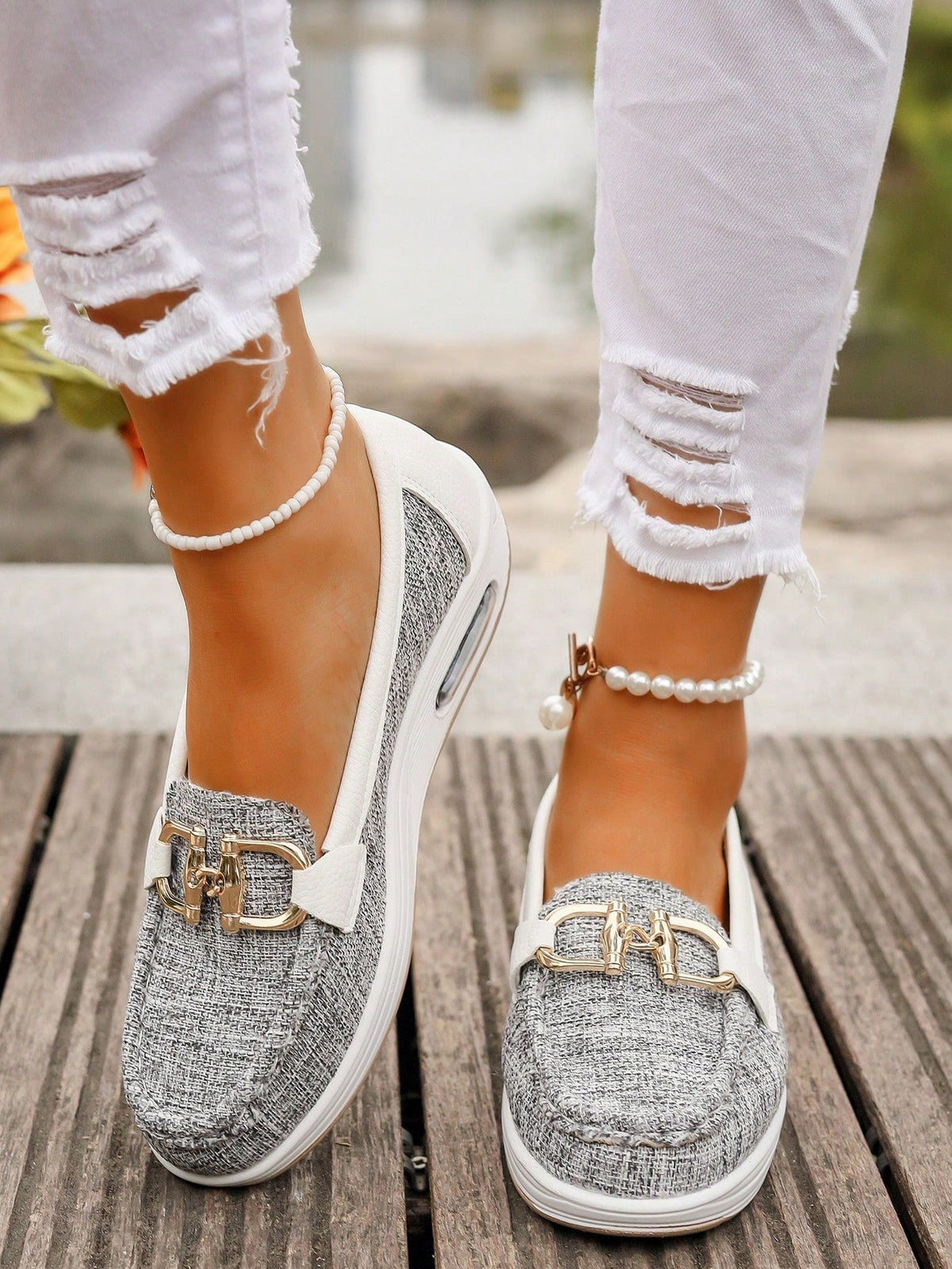 Women's flat loafers with moc stitching and gold-tone buckle trim
