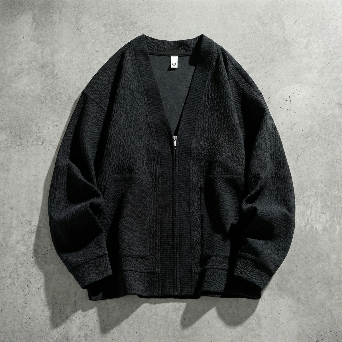 Women's oversized ribbed cardigan jacket with zip front and patch pockets