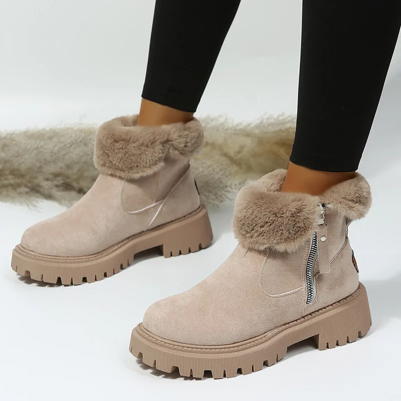 Women's ankle boots with plush fur cuffs, side zips and lugged soles