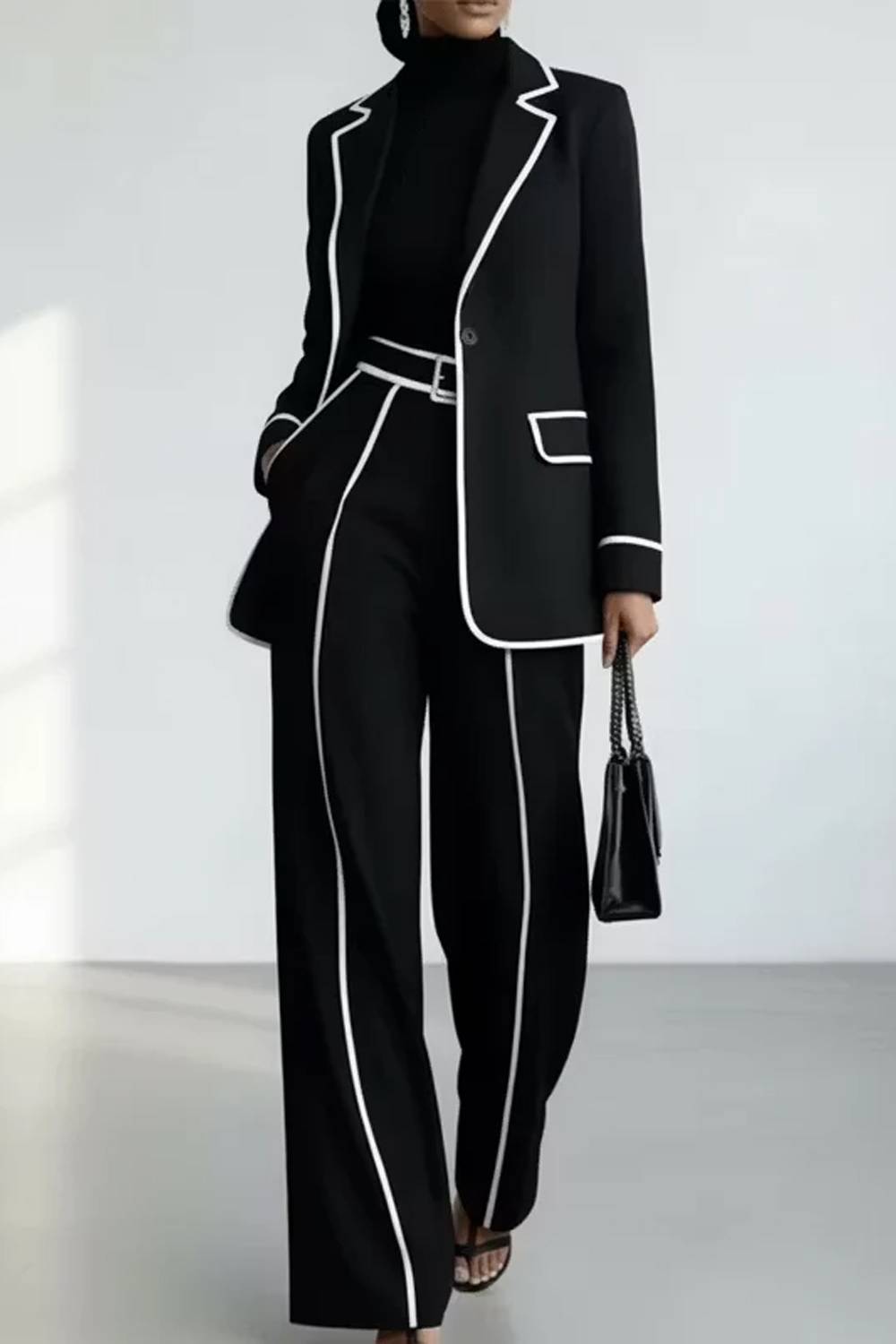 Women's two-piece trouser set with piped blazer and wide-leg trousers