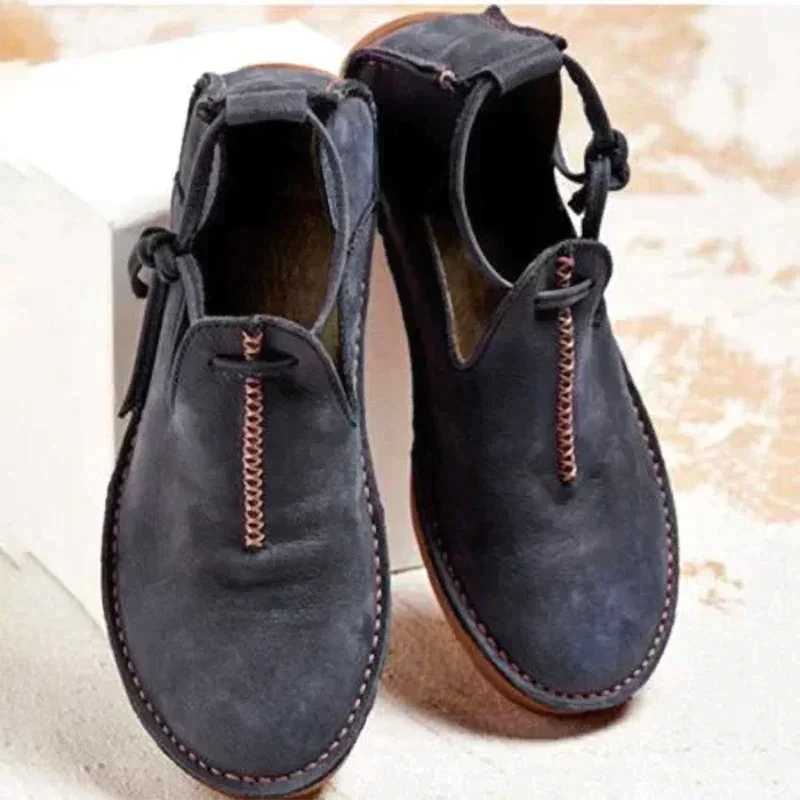 Women's ankle boots with round toes, stitched edging and side ties