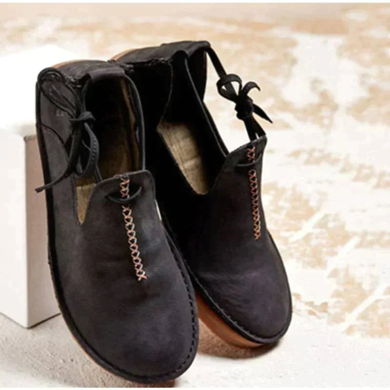 Women's ankle boots with round toes, stitched edging and side ties