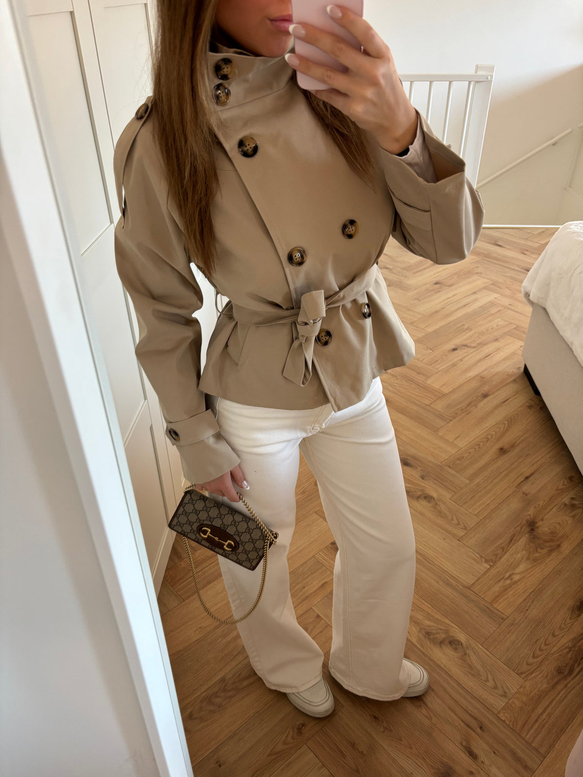 Women's beige belted trench jacket with high collar and long sleeves