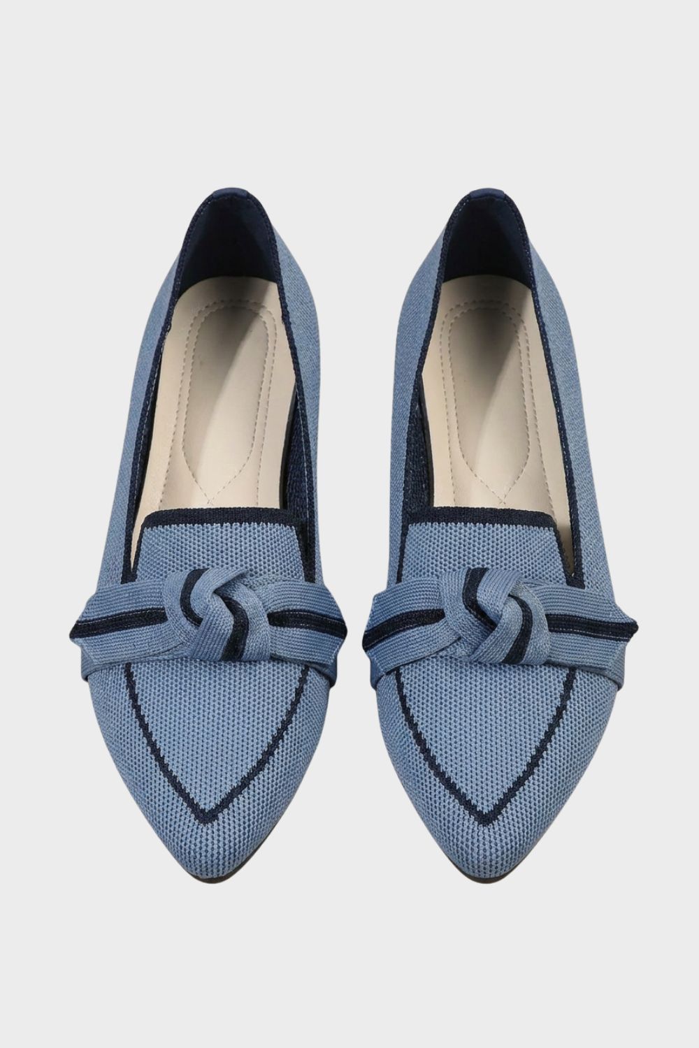 Women's pointed-toe loafers with bow trim and contrast edging