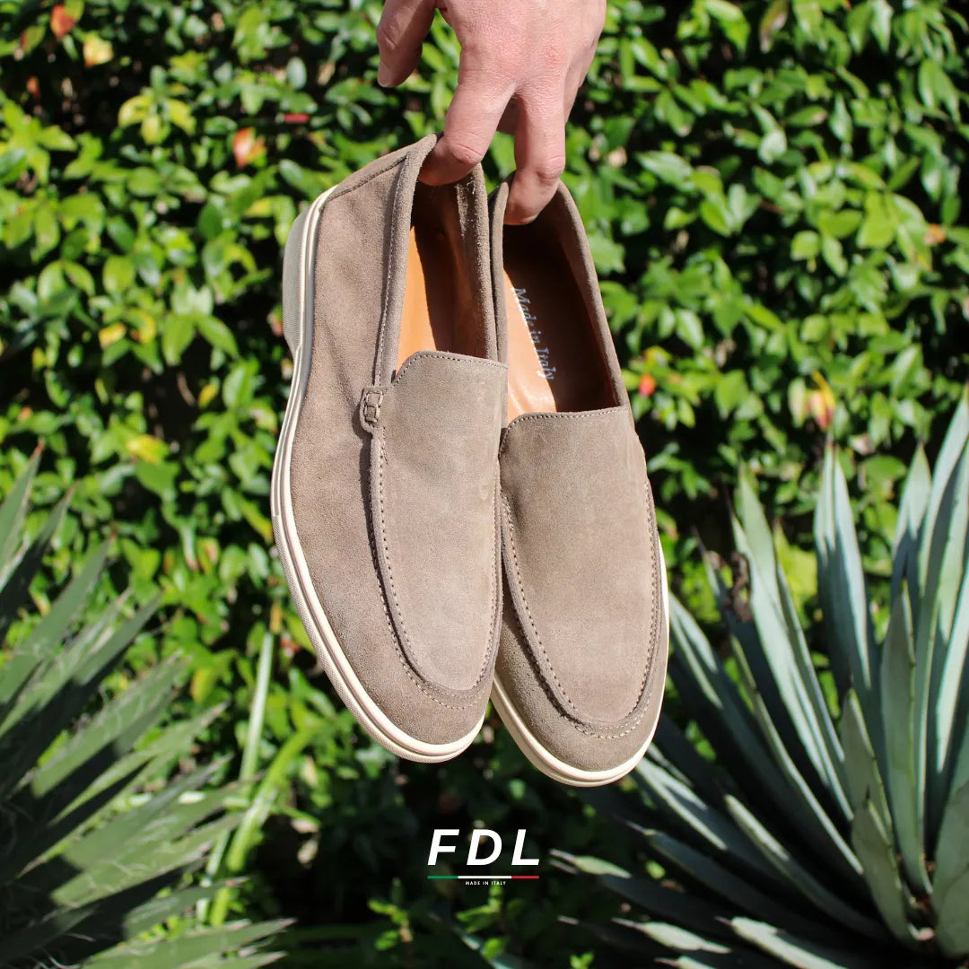 Men's beige slip-on loafers with moc toe stitching and cream soles