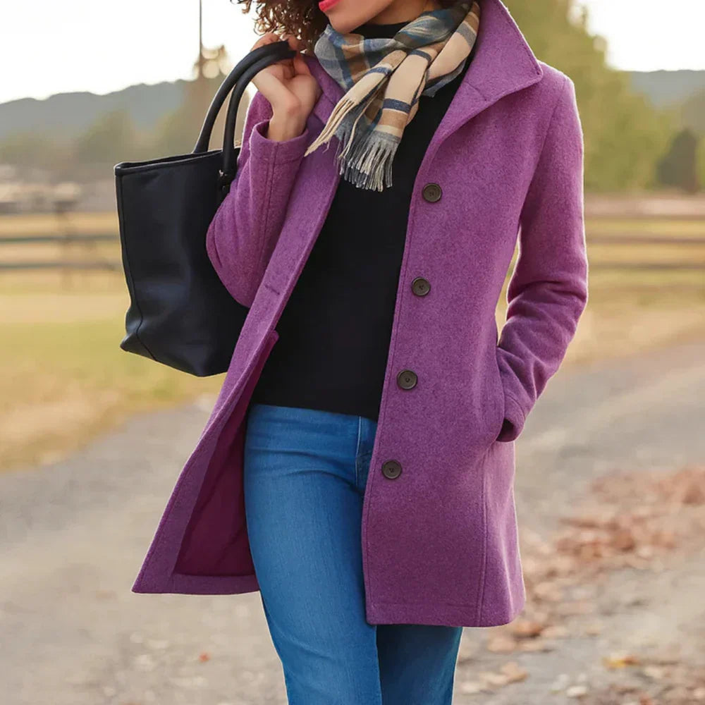 Women's long button-front coat with shirt collar, long sleeves and side pockets