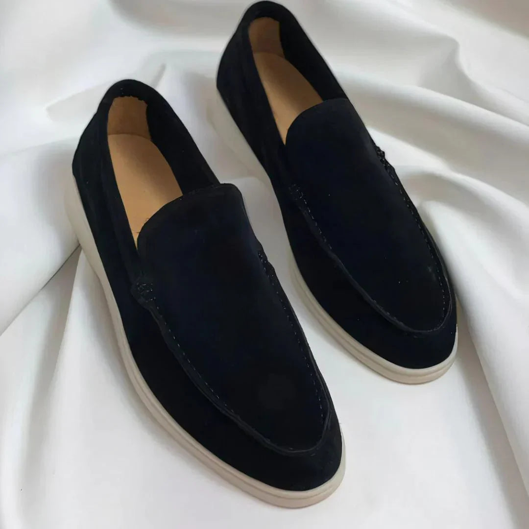 Men's slip-on loafers with almond toes, stitched detailing and flat contrasting soles