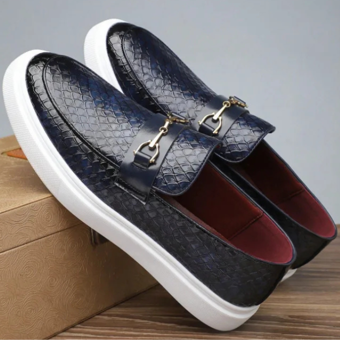 Men's textured slip-on loafers with buckle detail and contrasting flat soles