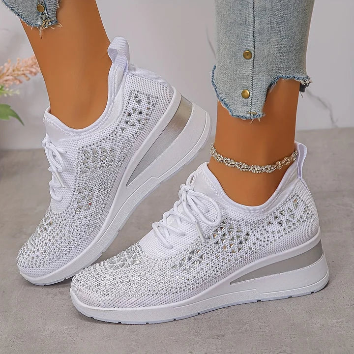 Women's lace-up mesh trainers with textured uppers and contrasting low-profile soles