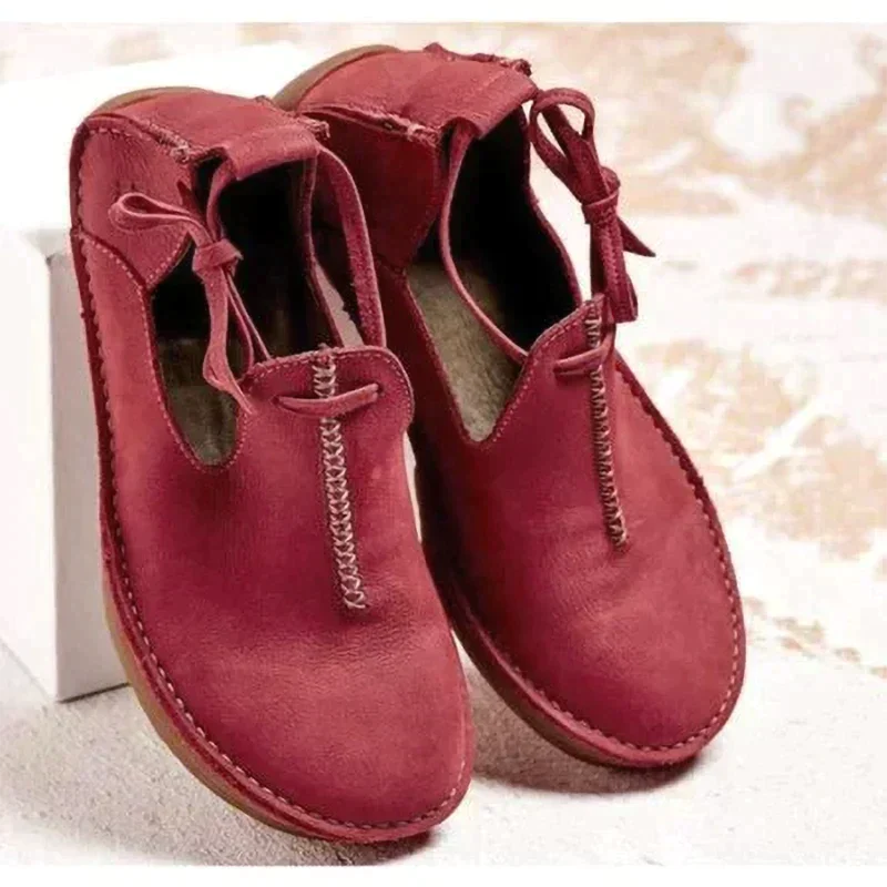 Women's ankle boots with round toes, stitched edging and side ties