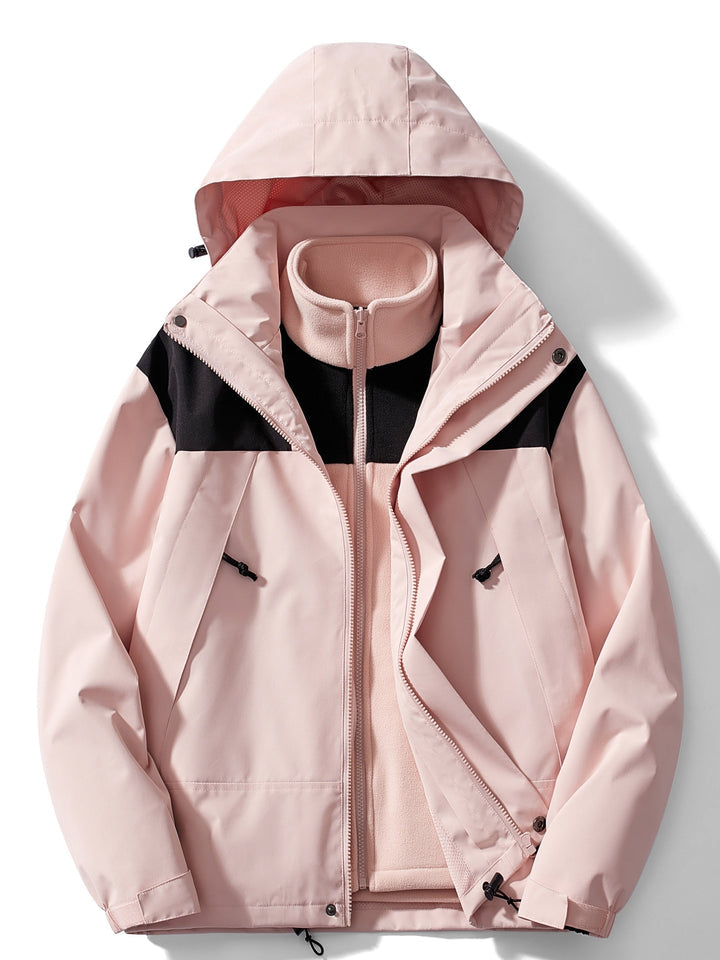 Women's hooded layered outdoor jacket with long sleeves and zipped pockets