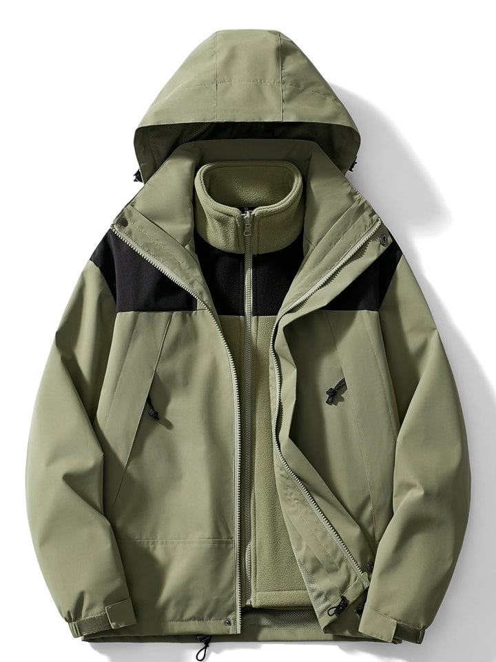 Women's hooded layered outdoor jacket with long sleeves and zipped pockets