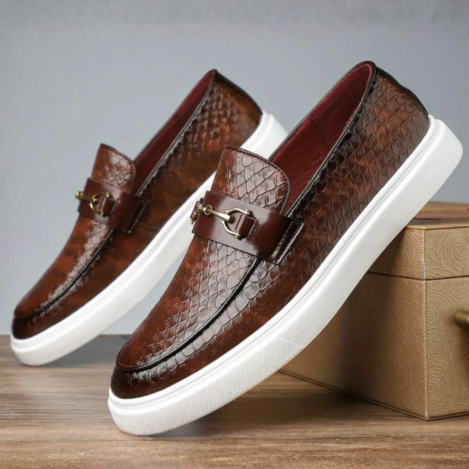 Men's textured slip-on loafers with buckle detail and contrasting flat soles