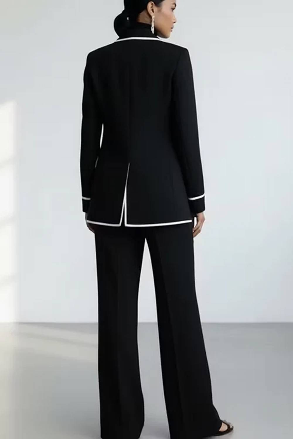 Women's two-piece trouser set with piped blazer and wide-leg trousers